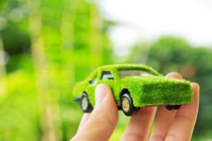 12602171 - hand holding eco car icon concept